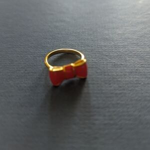 Gold Ring with Red Bow Accent